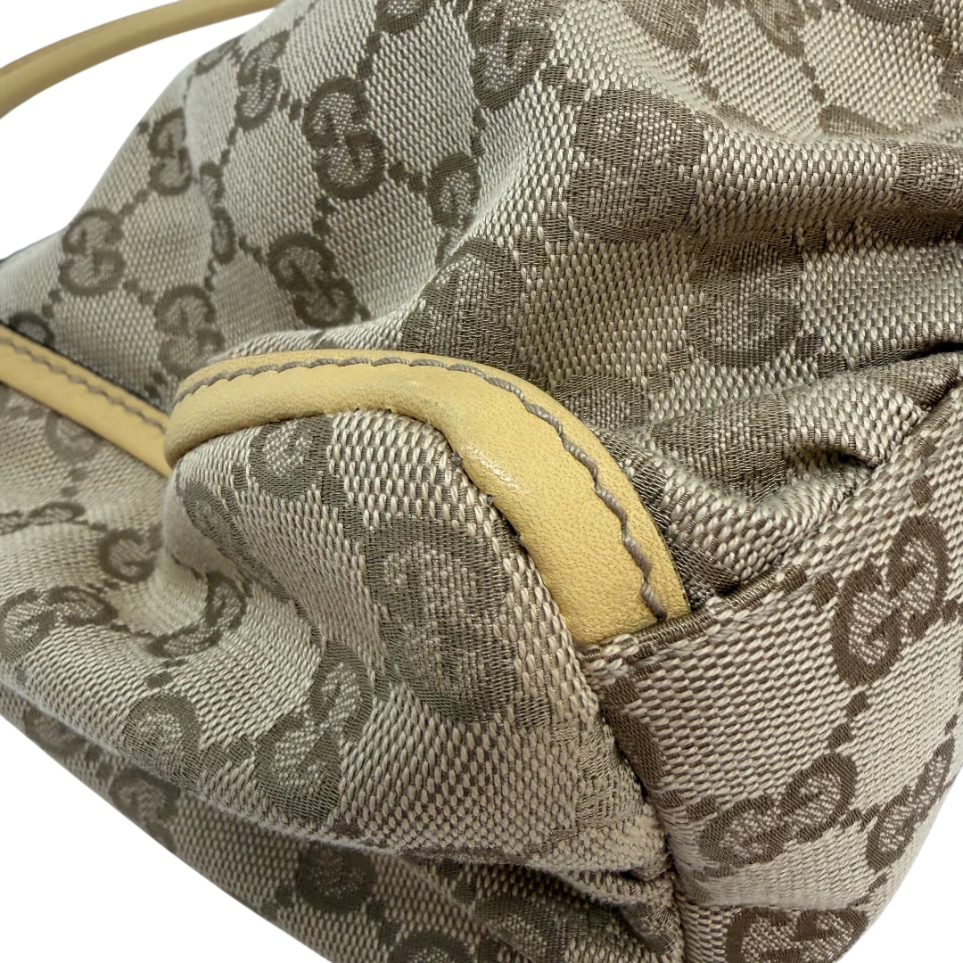 https://cdn.shopify.com/s/files/1/0564/9376/8855/files/Gucci_Schultertasche_D-Ring_medium_monogram_beige_vintage_GG6905.webp?v=1779286243