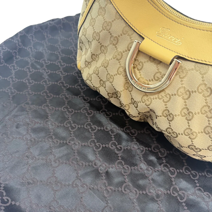 https://cdn.shopify.com/s/files/1/0564/9376/8855/files/Gucci_Schultertasche_D-Ring_medium_monogram_beige_vintage_GG6913.webp?v=1779286243