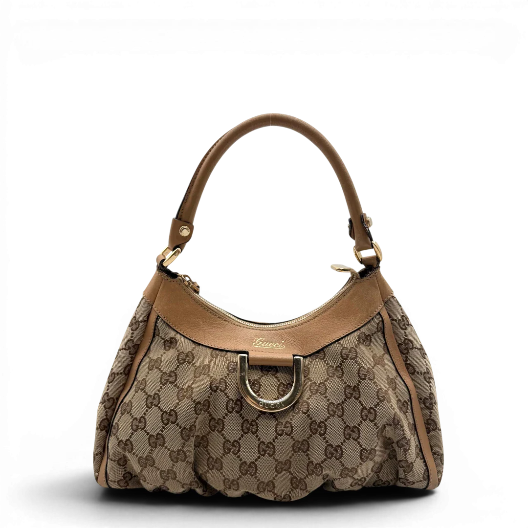 https://cdn.shopify.com/s/files/1/0564/9376/8855/files/Gucci_Schultertasche_D-Ring_medium_monogram_beige_vintage_GG8410.webp?v=1781108709