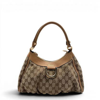 https://cdn.shopify.com/s/files/1/0564/9376/8855/files/Gucci_Schultertasche_D-Ring_medium_monogram_beige_vintage_GG8410.webp?v=1781108709
