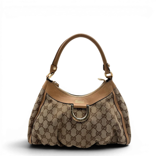 https://cdn.shopify.com/s/files/1/0564/9376/8855/files/Gucci_Schultertasche_D-Ring_medium_monogram_beige_vintage_GG8410.webp?v=1781108709