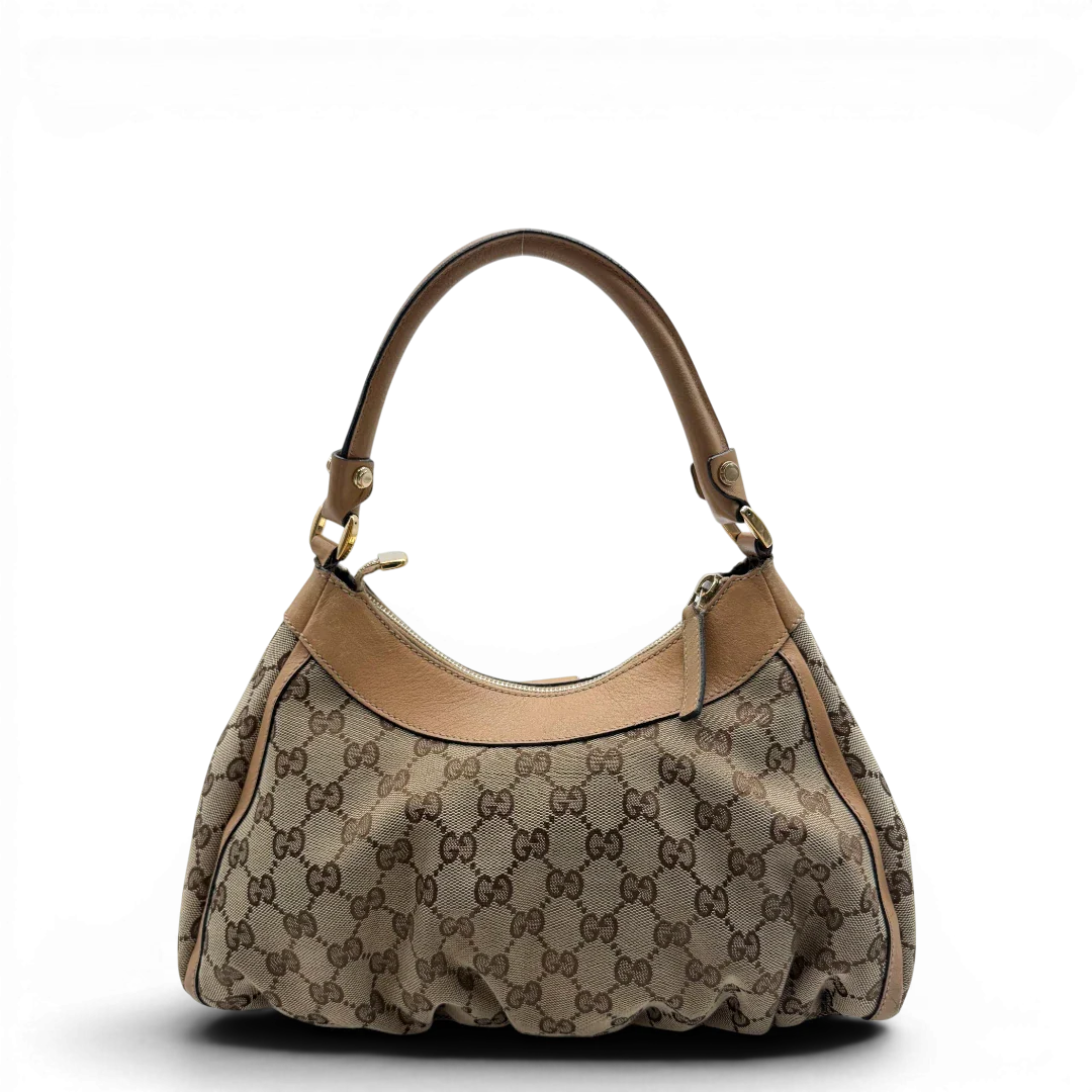 https://cdn.shopify.com/s/files/1/0564/9376/8855/files/Gucci_Schultertasche_D-Ring_medium_monogram_beige_vintage_GG8411.webp?v=1781108709