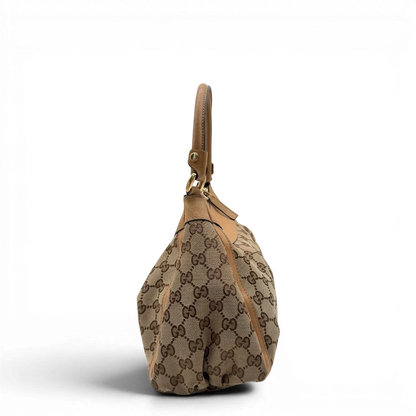 https://cdn.shopify.com/s/files/1/0564/9376/8855/files/Gucci_Schultertasche_D-Ring_medium_monogram_beige_vintage_GG8412.webp?v=1781108709