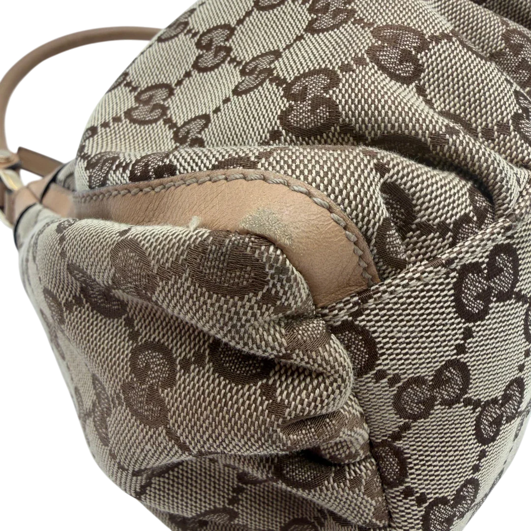 https://cdn.shopify.com/s/files/1/0564/9376/8855/files/Gucci_Schultertasche_D-Ring_medium_monogram_beige_vintage_GG8417.webp?v=1781108709