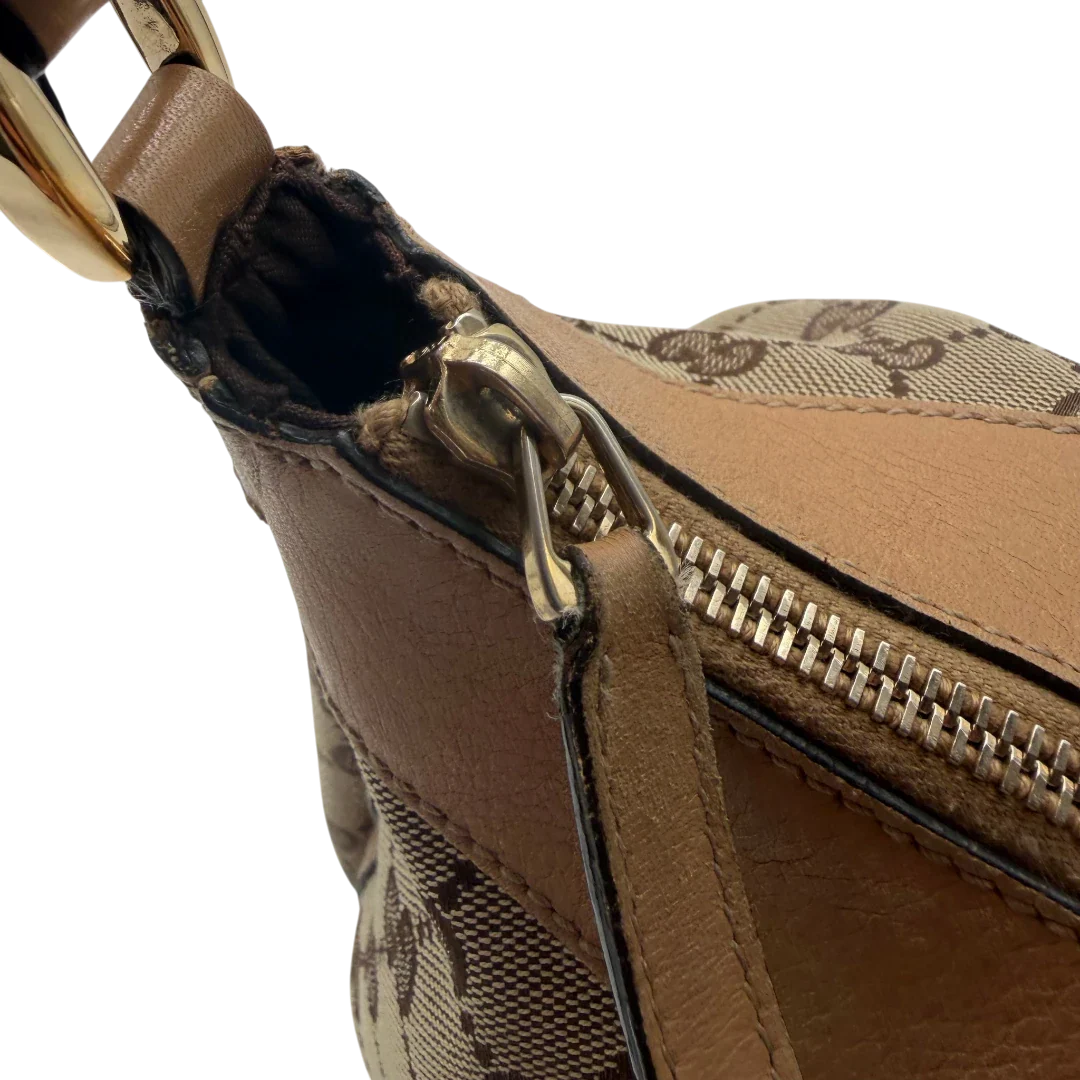 https://cdn.shopify.com/s/files/1/0564/9376/8855/files/Gucci_Schultertasche_D-Ring_medium_monogram_beige_vintage_GG8424.webp?v=1781108709