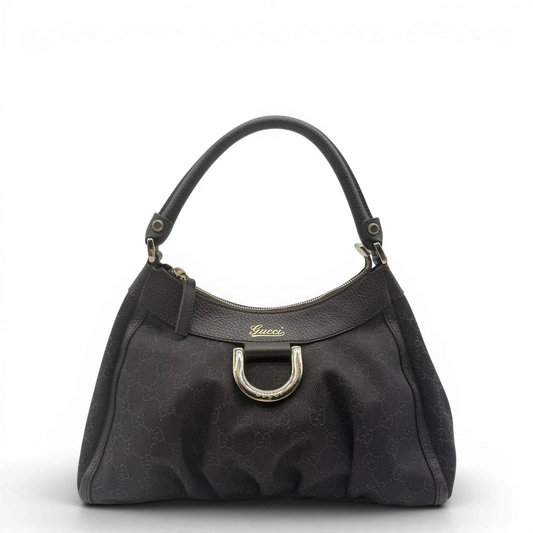 https://cdn.shopify.com/s/files/1/0564/9376/8855/files/Gucci_Schultertasche_D-Ring_medium_monogram_schwarz_vintage_GG6054.webp?v=1778081933