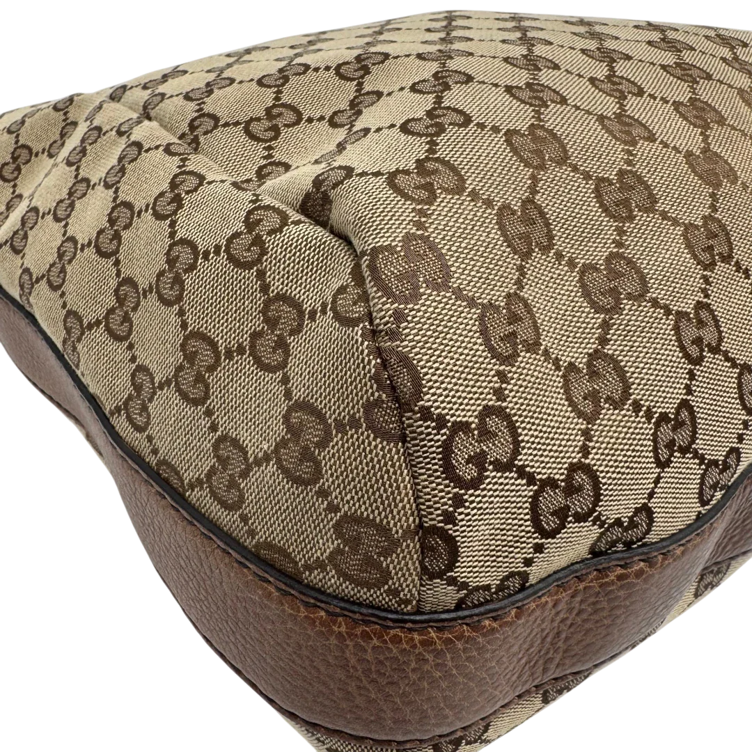 https://cdn.shopify.com/s/files/1/0564/9376/8855/files/Gucci_Schultertasche_Hobo_Bamboo_monogram_beige_vintage_GG2289.webp?v=1779968857