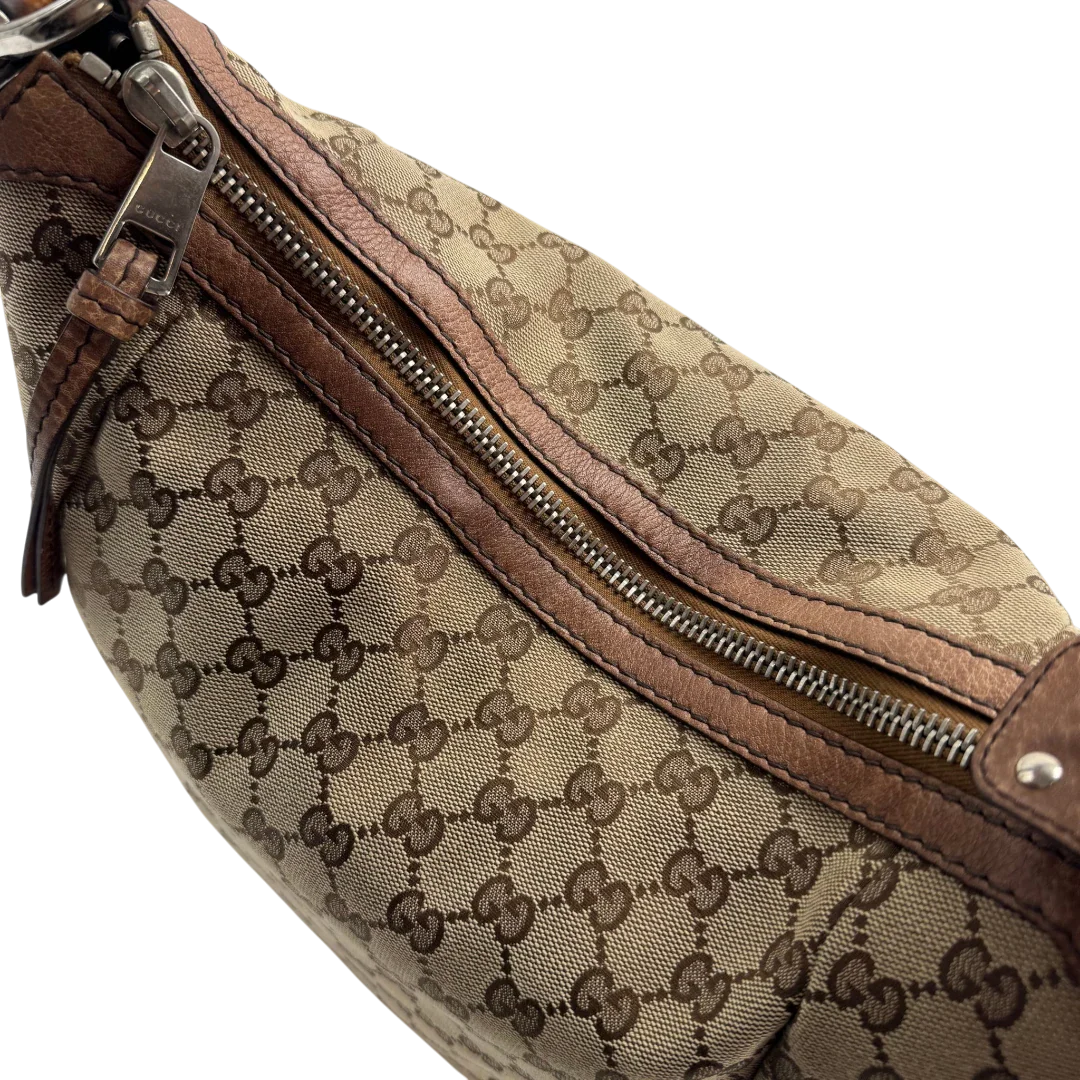 https://cdn.shopify.com/s/files/1/0564/9376/8855/files/Gucci_Schultertasche_Hobo_Bamboo_monogram_beige_vintage_GG2297.webp?v=1779968857