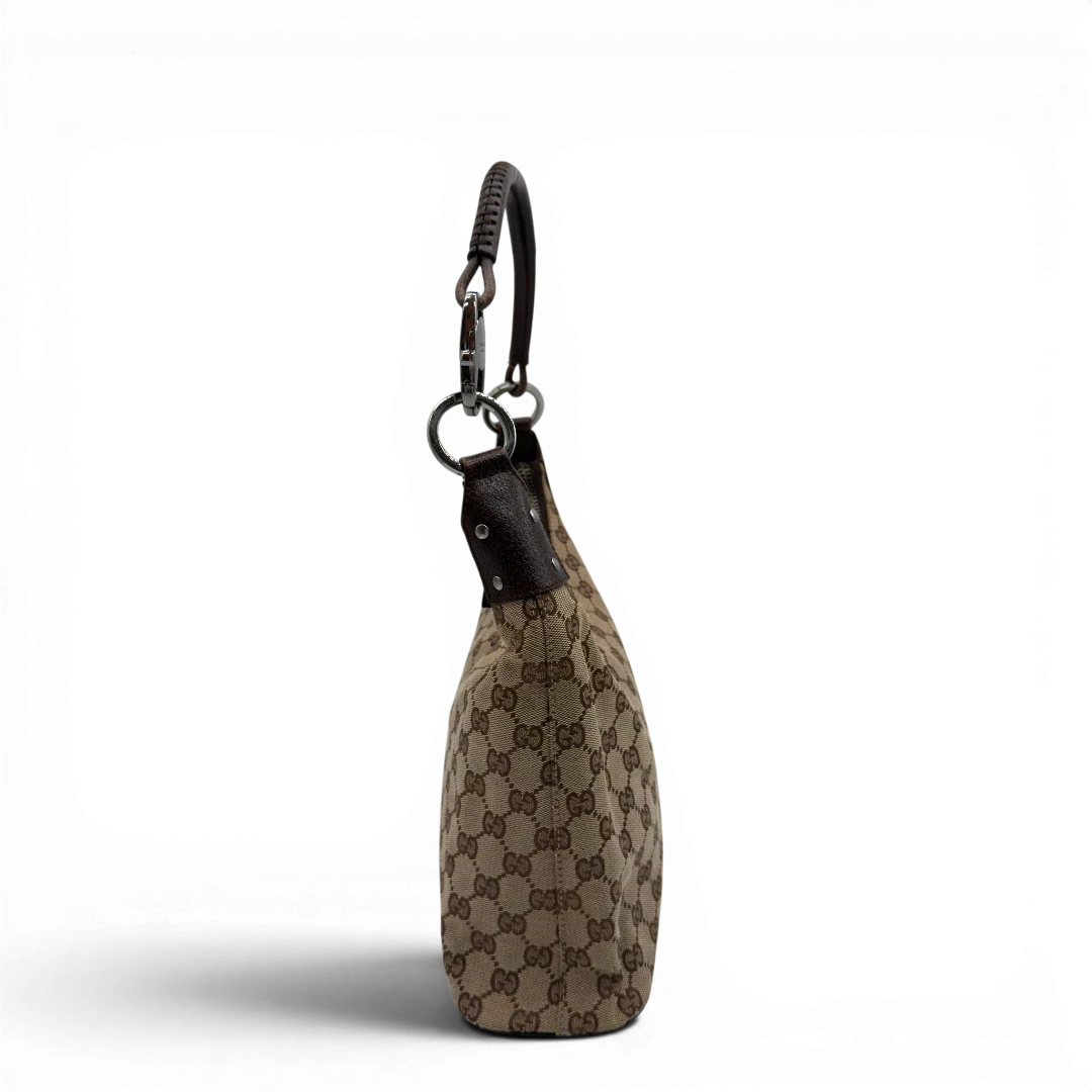 https://cdn.shopify.com/s/files/1/0564/9376/8855/files/Gucci_Schultertasche_Hobo_monogram_beige_vintage_GG8347.webp?v=1780575451