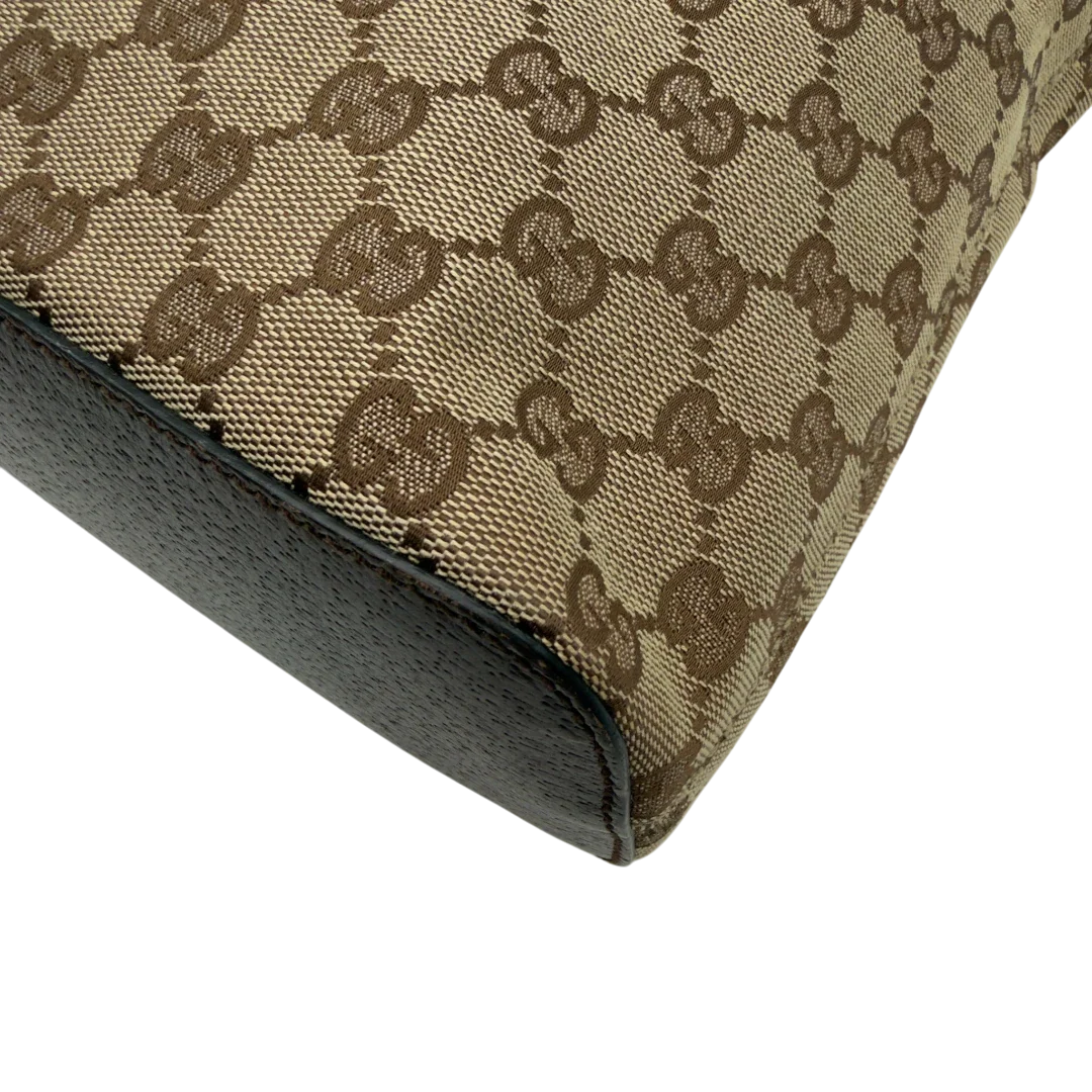 https://cdn.shopify.com/s/files/1/0564/9376/8855/files/Gucci_Schultertasche_Hobo_monogram_beige_vintage_GG8351.webp?v=1780575452
