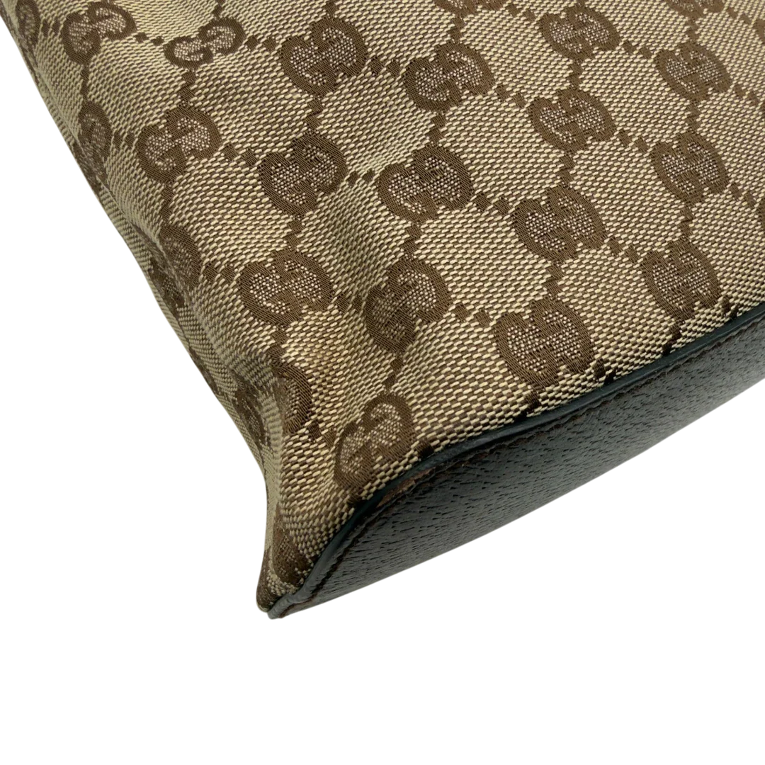 https://cdn.shopify.com/s/files/1/0564/9376/8855/files/Gucci_Schultertasche_Hobo_monogram_beige_vintage_GG8352.webp?v=1780575452