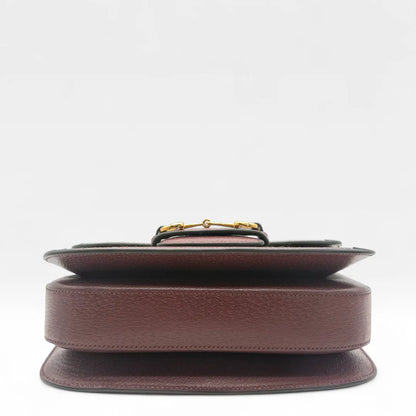 https://cdn.shopify.com/s/files/1/0564/9376/8855/files/Gucci_Schultertasche_Horsebit_1955_medium_monogram_rot_GG_shoulder_bag1036.webp?v=1761266552