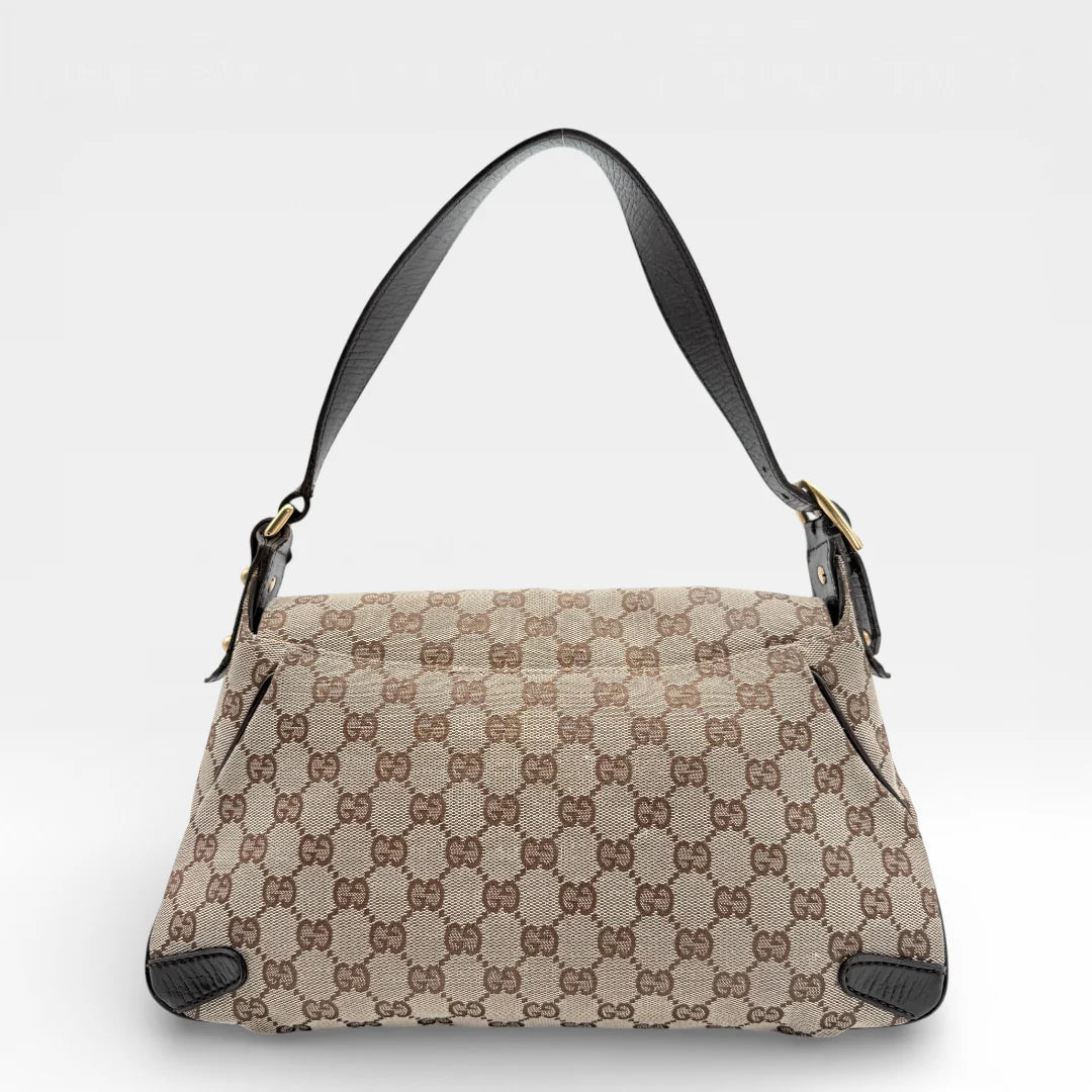 https://cdn.shopify.com/s/files/1/0564/9376/8855/files/Gucci_Schultertasche_Horsebit_1955_monogram_beige_vintage_GG_7212.webp?v=1767277034