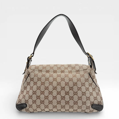 https://cdn.shopify.com/s/files/1/0564/9376/8855/files/Gucci_Schultertasche_Horsebit_1955_monogram_beige_vintage_GG_7212.webp?v=1767277034