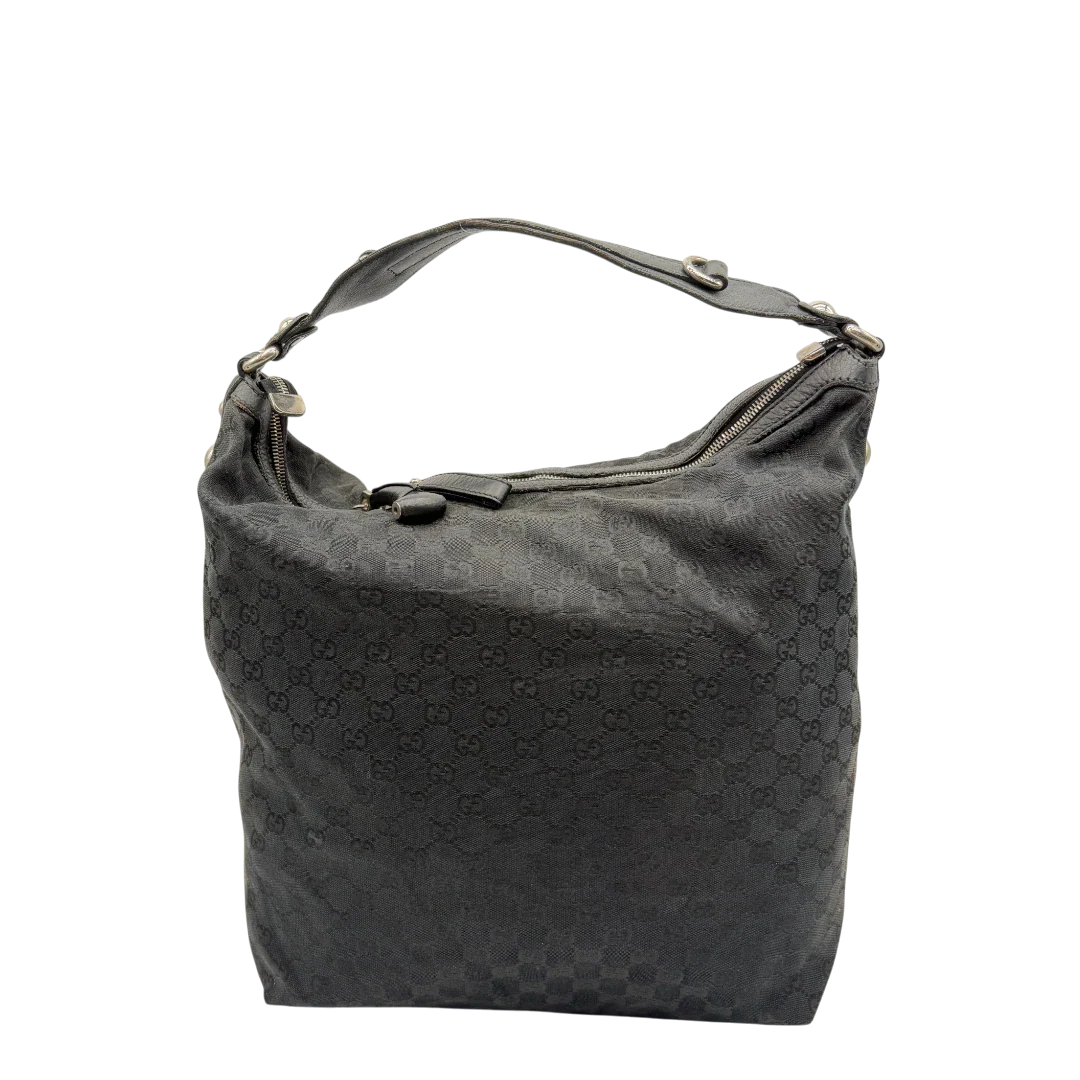 https://cdn.shopify.com/s/files/1/0564/9376/8855/files/Gucci_Schultertasche_Horsebit_Hobo_large_monogram_schwarz_1.webp?v=1781855742