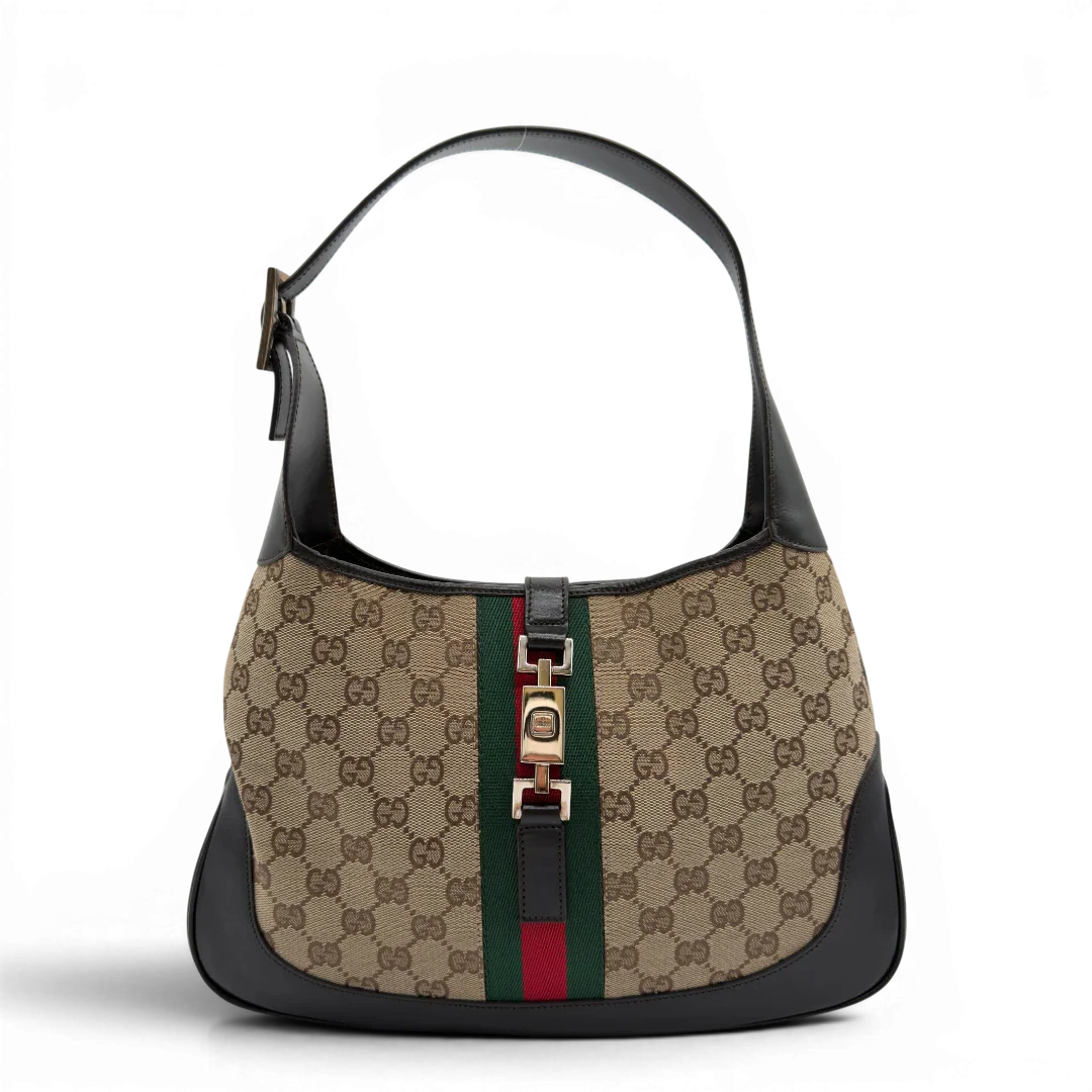 https://cdn.shopify.com/s/files/1/0564/9376/8855/files/Gucci_Schultertasche_Jackie_Sherry_Line_monogram_beige_vintage_GG7460.webp?v=1779290407