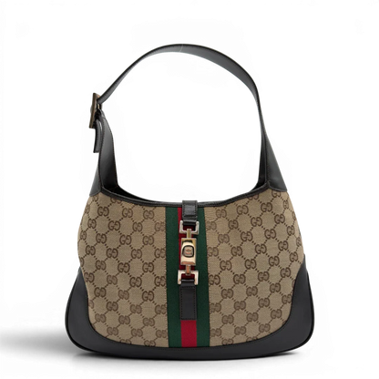 https://cdn.shopify.com/s/files/1/0564/9376/8855/files/Gucci_Schultertasche_Jackie_Sherry_Line_monogram_beige_vintage_GG7460.webp?v=1779290407