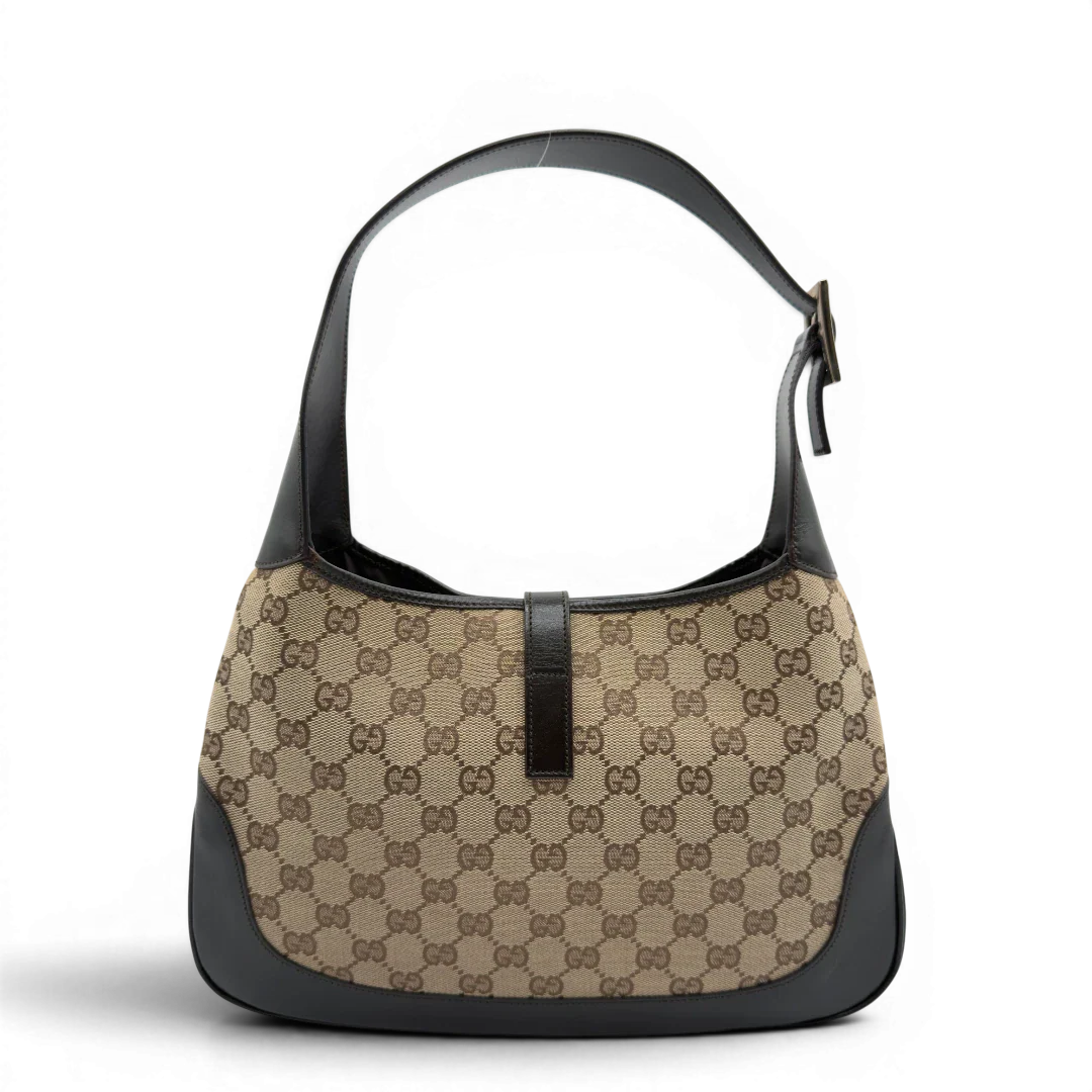 https://cdn.shopify.com/s/files/1/0564/9376/8855/files/Gucci_Schultertasche_Jackie_Sherry_Line_monogram_beige_vintage_GG7461.webp?v=1779290407