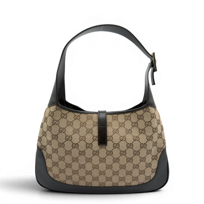 https://cdn.shopify.com/s/files/1/0564/9376/8855/files/Gucci_Schultertasche_Jackie_Sherry_Line_monogram_beige_vintage_GG7461.webp?v=1779290407