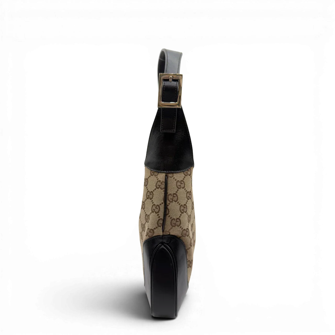https://cdn.shopify.com/s/files/1/0564/9376/8855/files/Gucci_Schultertasche_Jackie_Sherry_Line_monogram_beige_vintage_GG7462.webp?v=1779290407