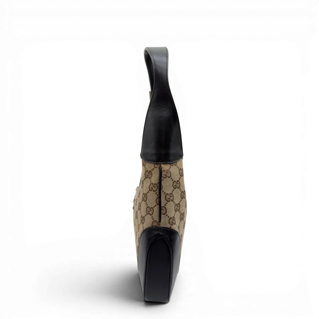 https://cdn.shopify.com/s/files/1/0564/9376/8855/files/Gucci_Schultertasche_Jackie_Sherry_Line_monogram_beige_vintage_GG7463.webp?v=1779290406