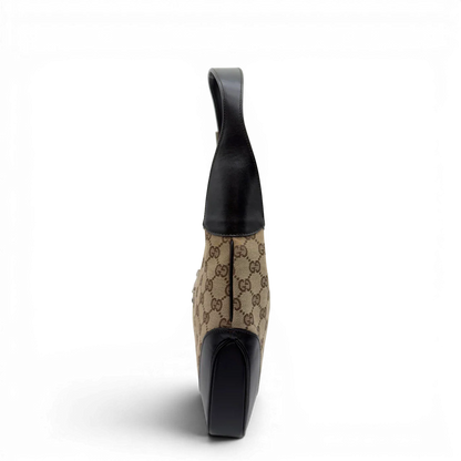 https://cdn.shopify.com/s/files/1/0564/9376/8855/files/Gucci_Schultertasche_Jackie_Sherry_Line_monogram_beige_vintage_GG7463.webp?v=1779290406