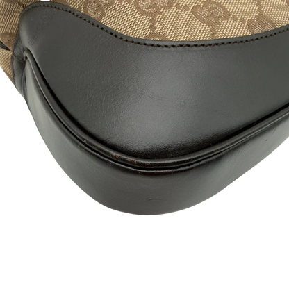 https://cdn.shopify.com/s/files/1/0564/9376/8855/files/Gucci_Schultertasche_Jackie_Sherry_Line_monogram_beige_vintage_GG7466.webp?v=1779290407