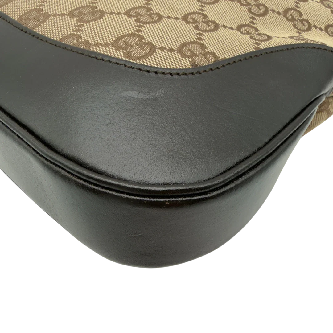 https://cdn.shopify.com/s/files/1/0564/9376/8855/files/Gucci_Schultertasche_Jackie_Sherry_Line_monogram_beige_vintage_GG7467.webp?v=1779290407