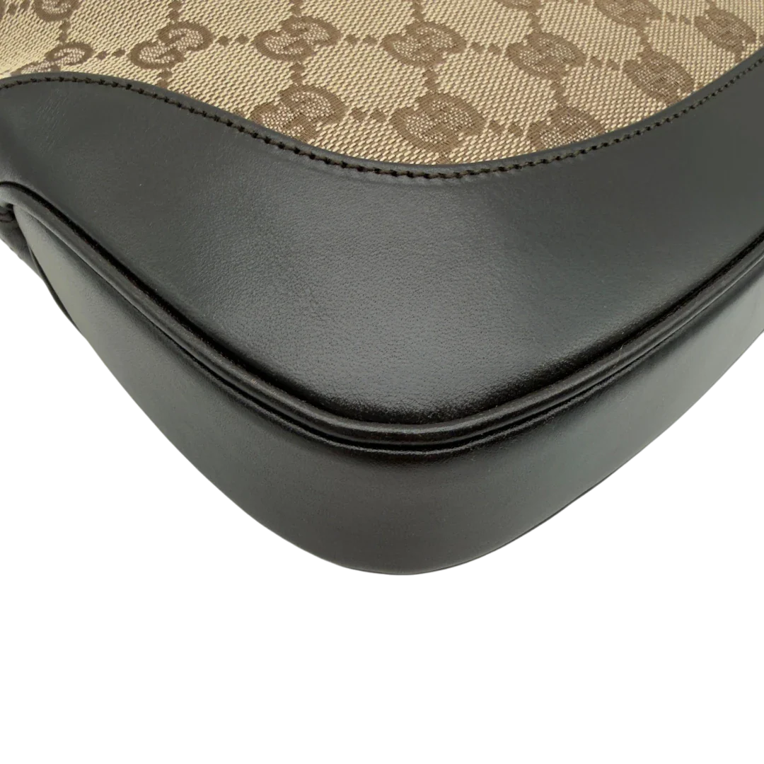 https://cdn.shopify.com/s/files/1/0564/9376/8855/files/Gucci_Schultertasche_Jackie_Sherry_Line_monogram_beige_vintage_GG7468.webp?v=1779290407