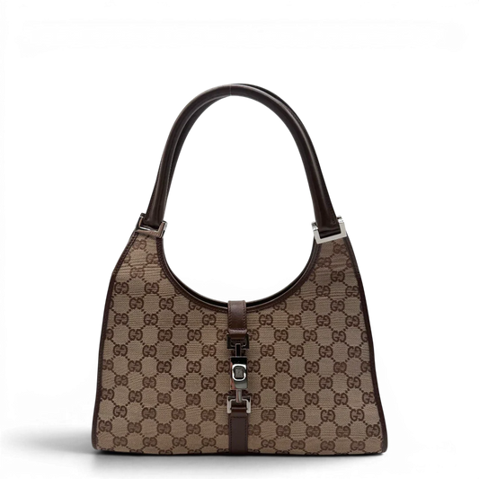https://cdn.shopify.com/s/files/1/0564/9376/8855/files/Gucci_Schultertasche_Jackie_monogram_beige___braun_vintage_GG7377.webp?v=1779964270