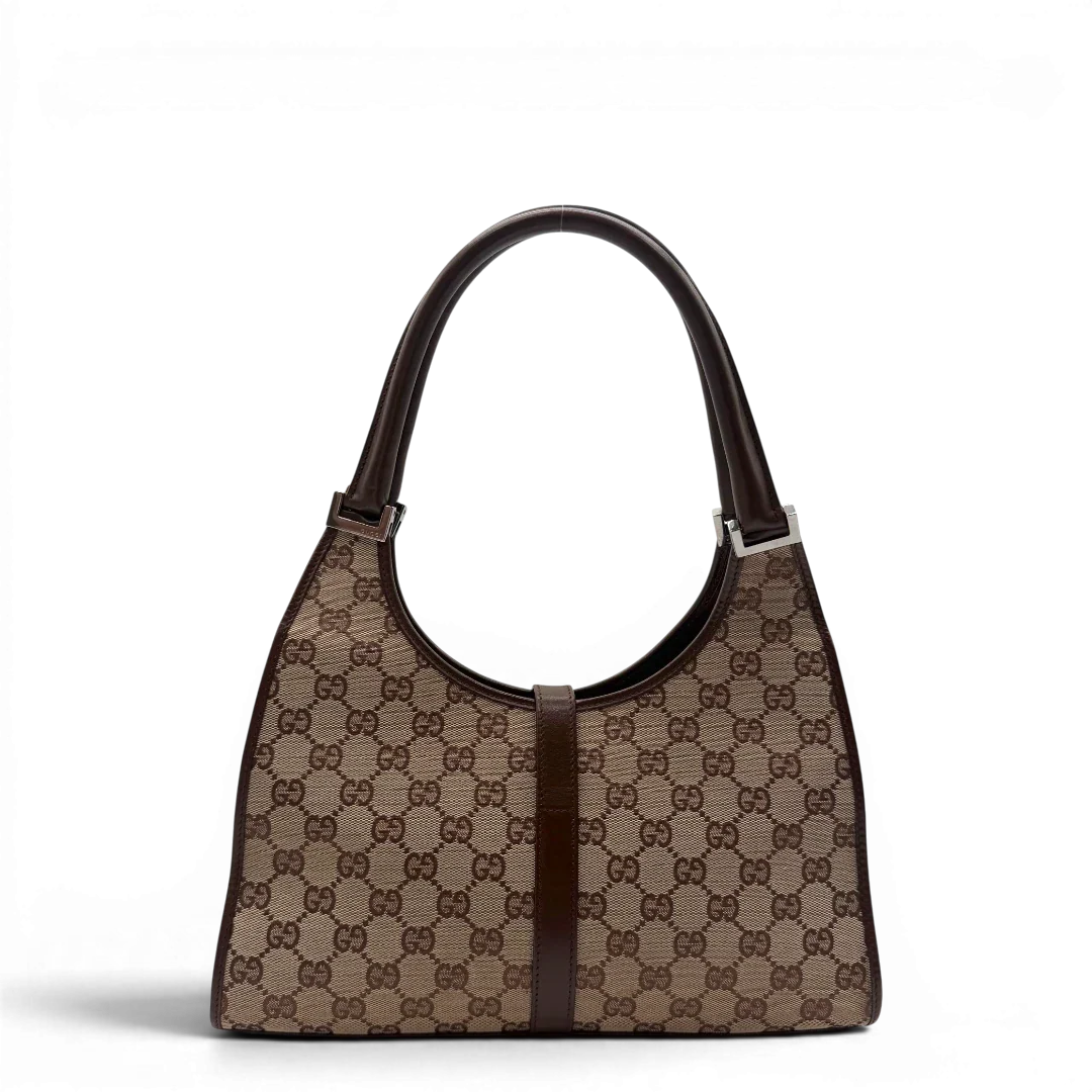 https://cdn.shopify.com/s/files/1/0564/9376/8855/files/Gucci_Schultertasche_Jackie_monogram_beige___braun_vintage_GG7378.webp?v=1779964271