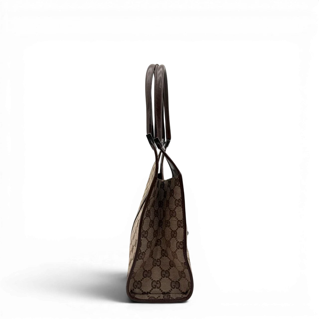 https://cdn.shopify.com/s/files/1/0564/9376/8855/files/Gucci_Schultertasche_Jackie_monogram_beige___braun_vintage_GG7380.webp?v=1779964270