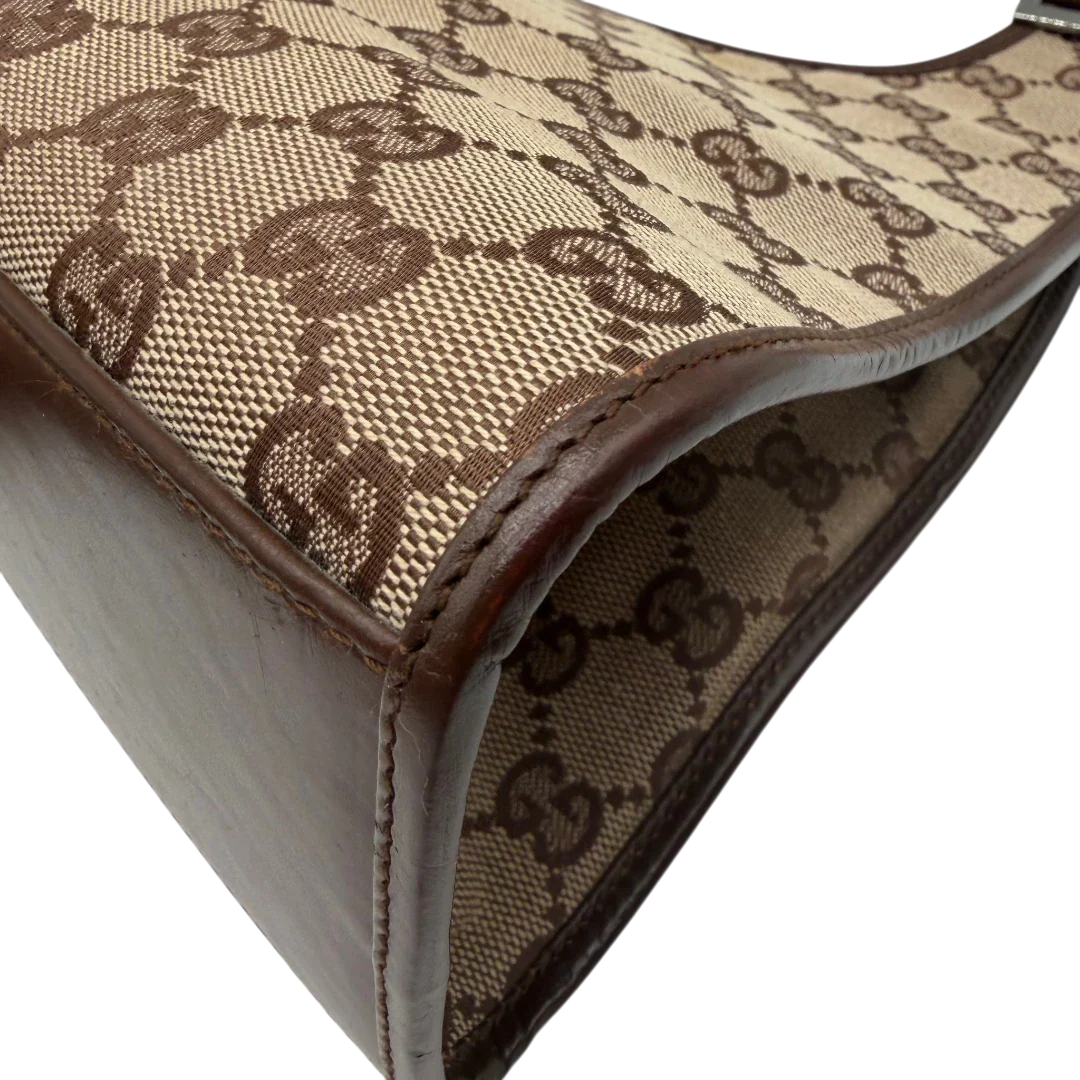 https://cdn.shopify.com/s/files/1/0564/9376/8855/files/Gucci_Schultertasche_Jackie_monogram_beige___braun_vintage_GG7382.webp?v=1779964271