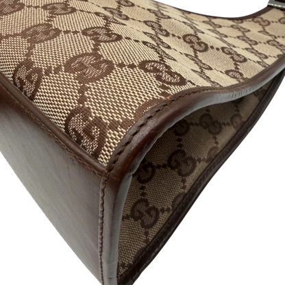 https://cdn.shopify.com/s/files/1/0564/9376/8855/files/Gucci_Schultertasche_Jackie_monogram_beige___braun_vintage_GG7382.webp?v=1779964271