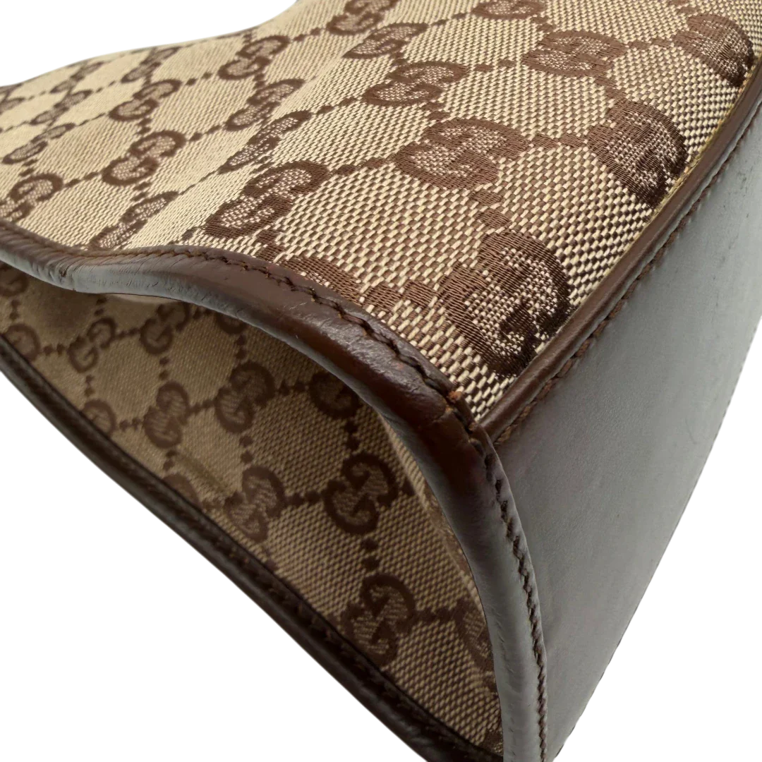 https://cdn.shopify.com/s/files/1/0564/9376/8855/files/Gucci_Schultertasche_Jackie_monogram_beige___braun_vintage_GG7383.webp?v=1779964271