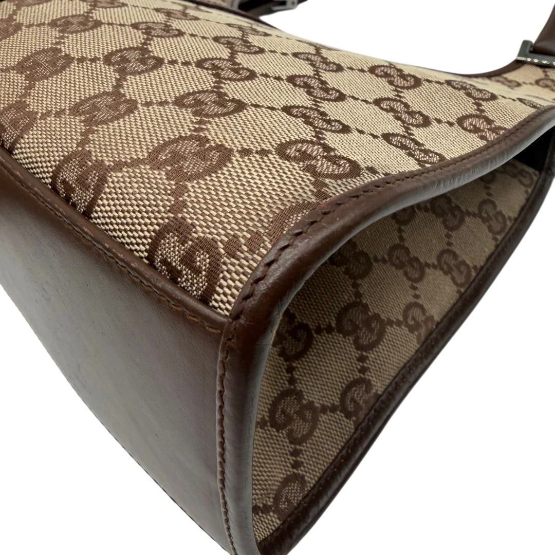 https://cdn.shopify.com/s/files/1/0564/9376/8855/files/Gucci_Schultertasche_Jackie_monogram_beige___braun_vintage_GG7384.webp?v=1779964270