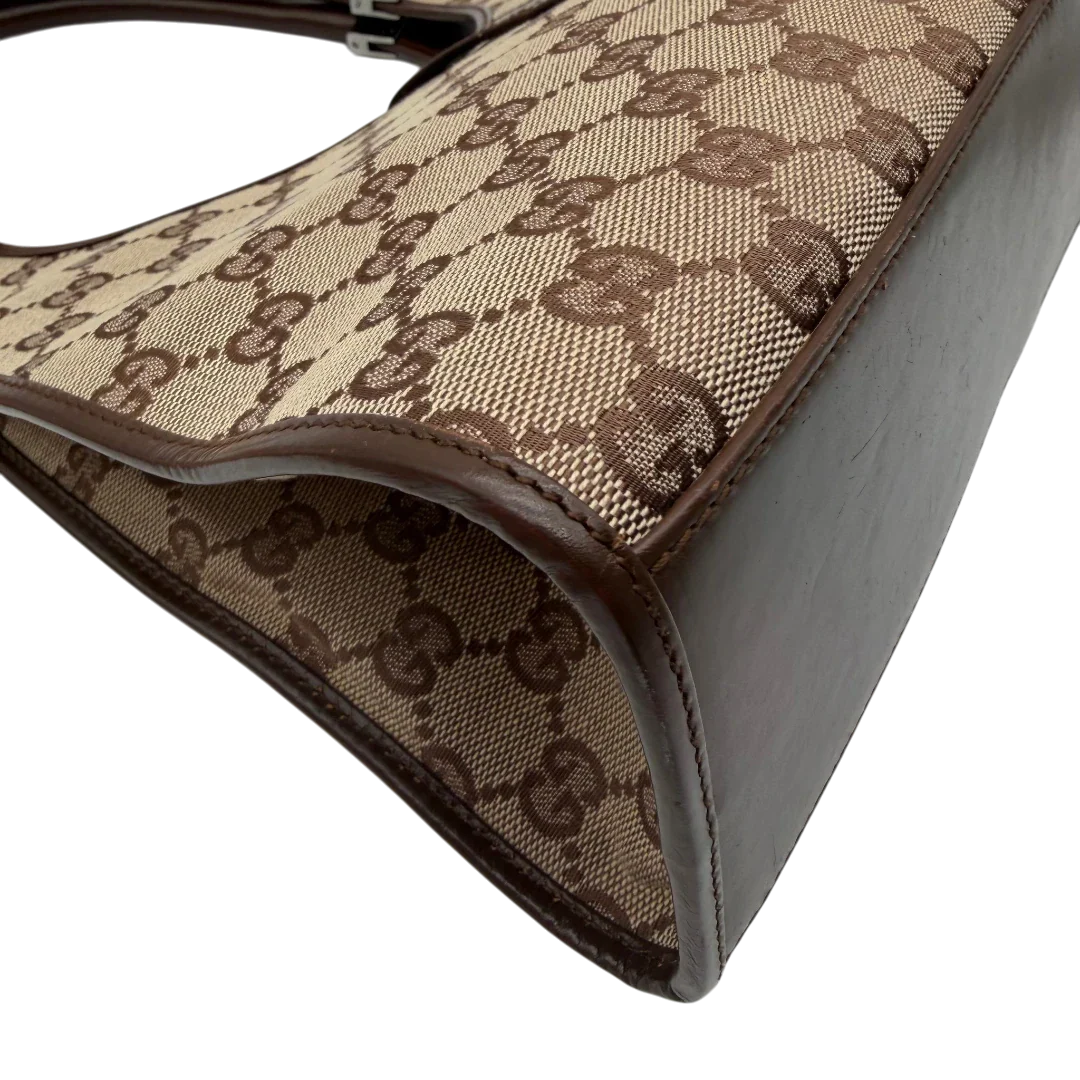 https://cdn.shopify.com/s/files/1/0564/9376/8855/files/Gucci_Schultertasche_Jackie_monogram_beige___braun_vintage_GG7385.webp?v=1779964271
