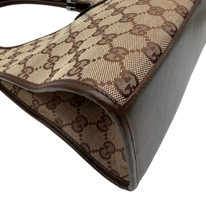 https://cdn.shopify.com/s/files/1/0564/9376/8855/files/Gucci_Schultertasche_Jackie_monogram_beige___braun_vintage_GG7385.webp?v=1779964271