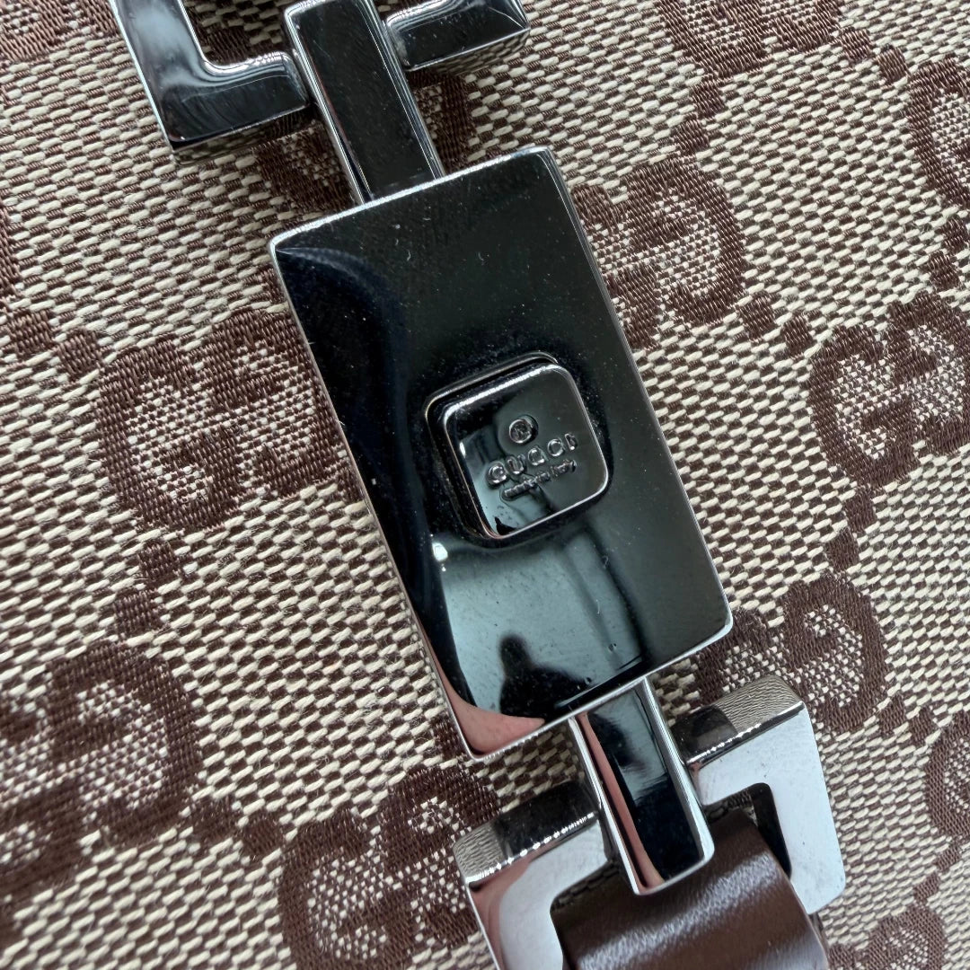 https://cdn.shopify.com/s/files/1/0564/9376/8855/files/Gucci_Schultertasche_Jackie_monogram_beige___braun_vintage_GG7387.webp?v=1779964271