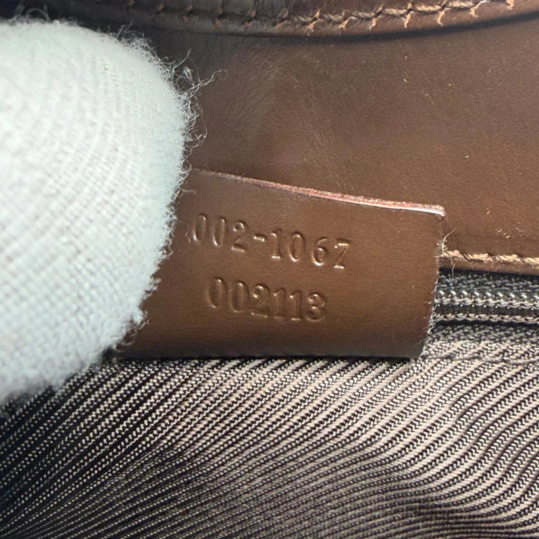 https://cdn.shopify.com/s/files/1/0564/9376/8855/files/Gucci_Schultertasche_Jackie_monogram_beige___braun_vintage_GG7392.webp?v=1779964271