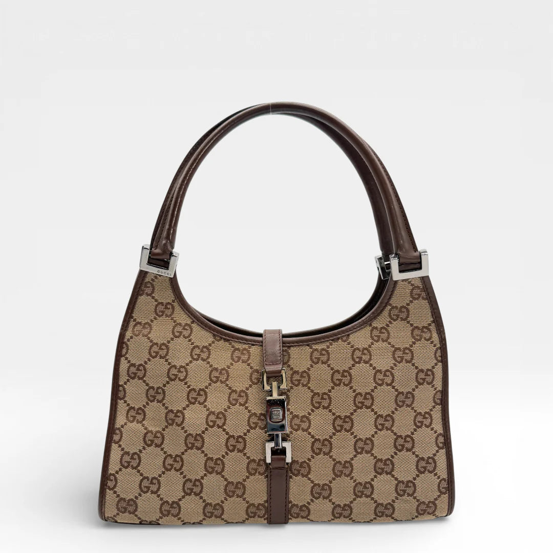 https://cdn.shopify.com/s/files/1/0564/9376/8855/files/Gucci_Schultertasche_Jackie_small_monogram_beige_vintage_GG_7374.webp?v=1767880670