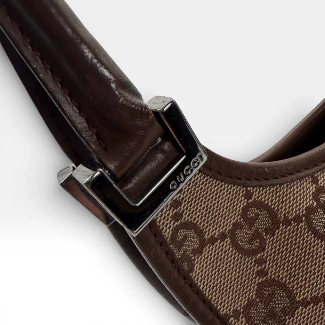 https://cdn.shopify.com/s/files/1/0564/9376/8855/files/Gucci_Schultertasche_Jackie_small_monogram_beige_vintage_GG_7393.webp?v=1767880712