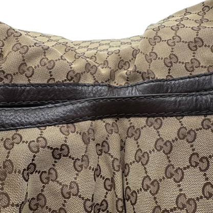 https://cdn.shopify.com/s/files/1/0564/9376/8855/files/Gucci_Schultertasche_Jockey_Hobo_large_monogram_beige_16.webp?v=1783516121