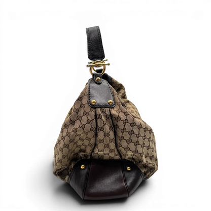 https://cdn.shopify.com/s/files/1/0564/9376/8855/files/Gucci_Schultertasche_Jockey_Hobo_large_monogram_beige_2.webp?v=1783516121