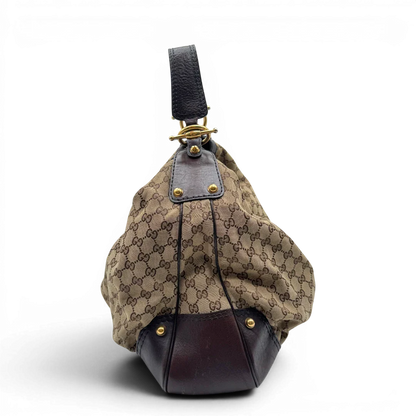 https://cdn.shopify.com/s/files/1/0564/9376/8855/files/Gucci_Schultertasche_Jockey_Hobo_large_monogram_beige_3.webp?v=1783516120