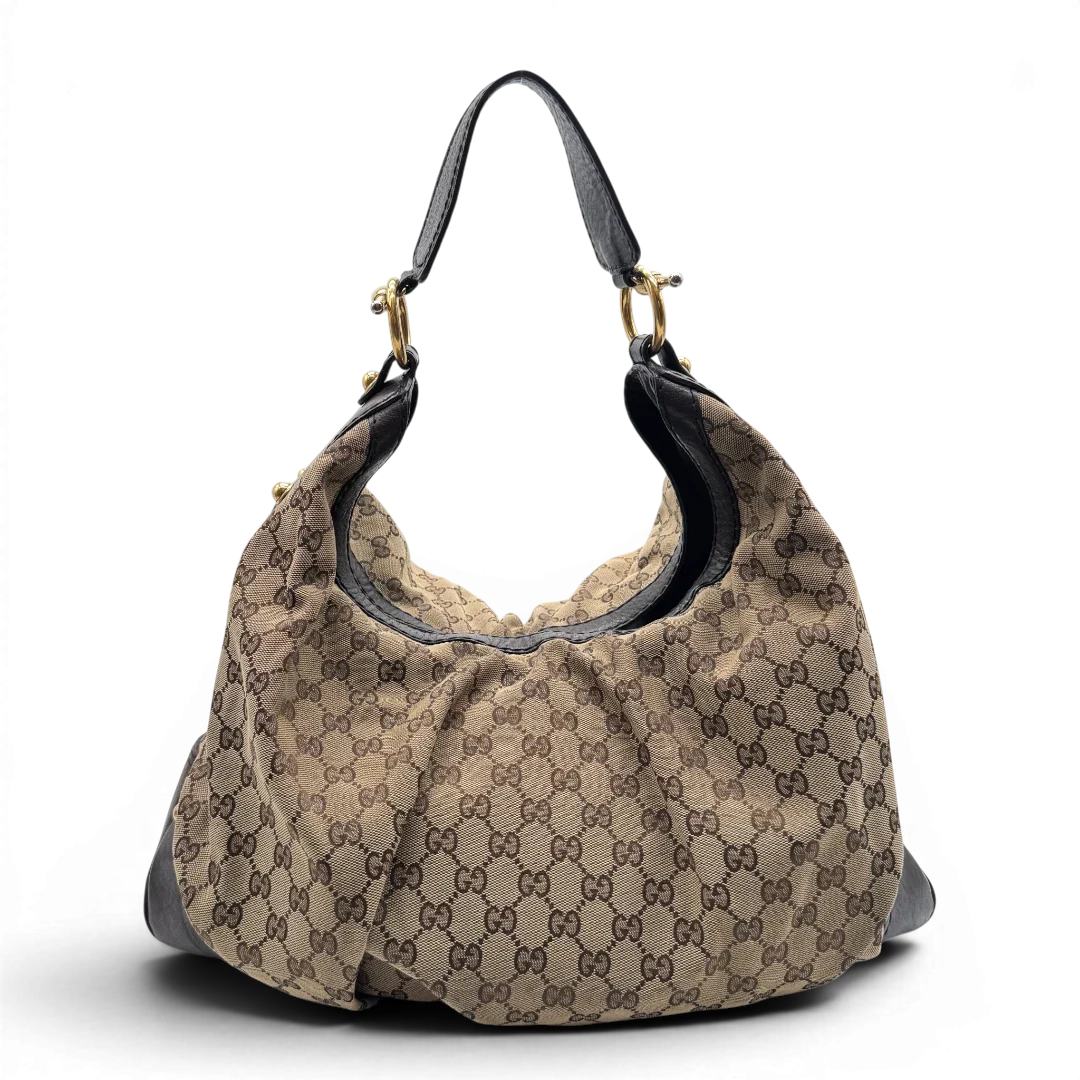 https://cdn.shopify.com/s/files/1/0564/9376/8855/files/Gucci_Schultertasche_Jockey_Hobo_large_monogram_beige_4.webp?v=1783516120