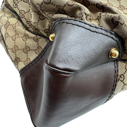 https://cdn.shopify.com/s/files/1/0564/9376/8855/files/Gucci_Schultertasche_Jockey_Hobo_large_monogram_beige_8.webp?v=1783516121
