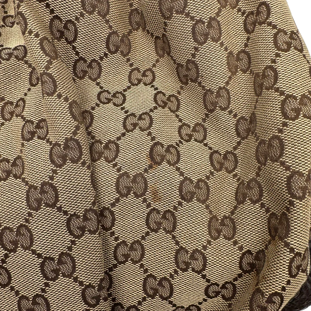 https://cdn.shopify.com/s/files/1/0564/9376/8855/files/Gucci_Schultertasche_Jockey_Hobo_large_monogram_beige_vintage_GG2162.webp?v=1779963372