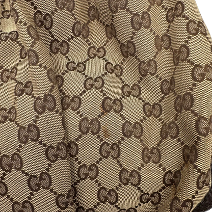 https://cdn.shopify.com/s/files/1/0564/9376/8855/files/Gucci_Schultertasche_Jockey_Hobo_large_monogram_beige_vintage_GG2162.webp?v=1779963372