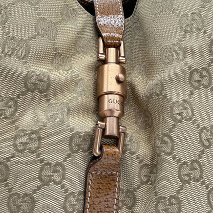 https://cdn.shopify.com/s/files/1/0564/9376/8855/files/Gucci_Schultertasche_New_Jackie_large_monogram_beige_vintage_GG6133.webp?v=1775065089
